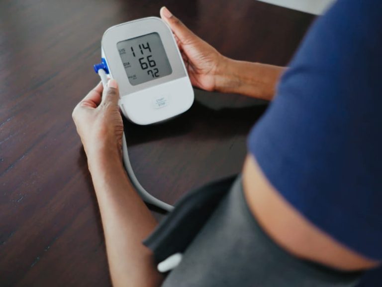 What is blood pressure and what numbers for it are considered normal?